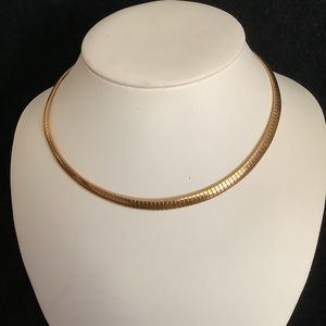 Gold tone omega necklace.